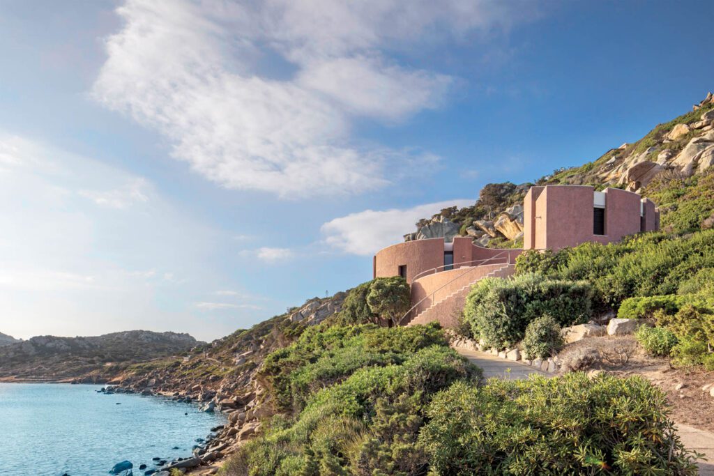 Access to the house via stairs and a pathway from the shore.