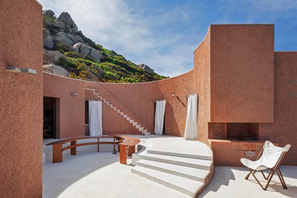 Partly enclosed by bedroom wings, Casa Rotonda’s circular central patio with stairs to a rooftop terrace.