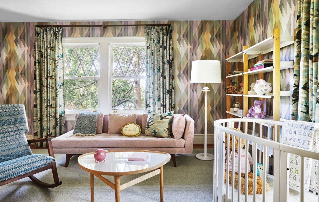 Daughter Marlowe’s bedroom features an Edward Wormley Knowland chaise, Finn Juhl Eye coffee table, and Lee Jofa’s Prism Pastel wallpaper.