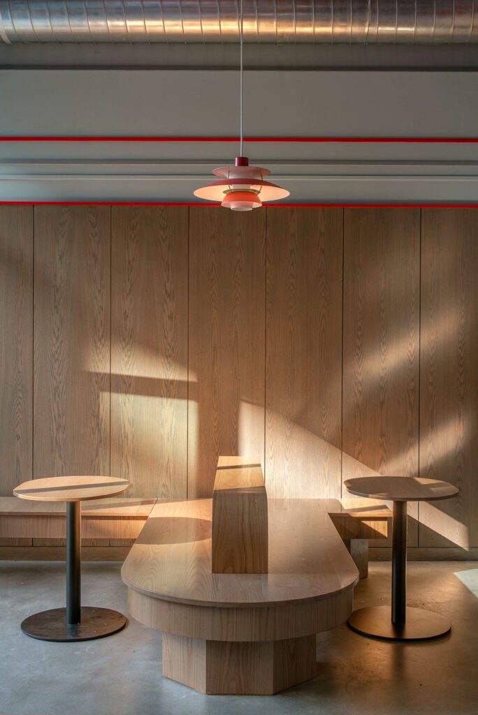 Poul Henningsen’s PH5 pendant from Louis Poulsen overlooks Patry’s custom red oak bench. 