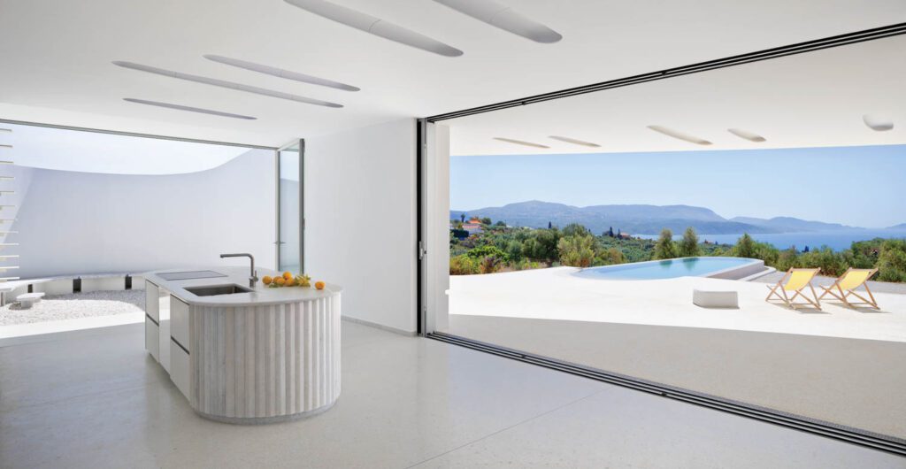 The south terrace is accessible via a 17-by-9-foot sliding glass door, constructed of three panels that recede into the wall, resulting in a boundless, indoor-outdoor volume. 