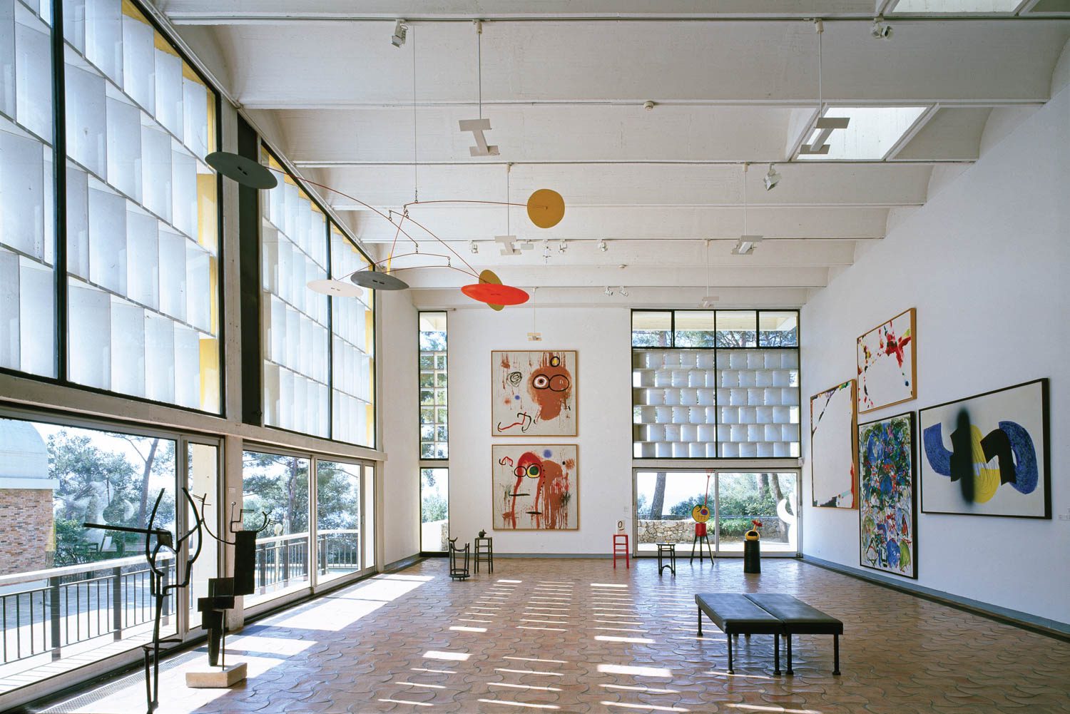 Artwork hangs from the walls and ceilings with sculptures lining the floors.