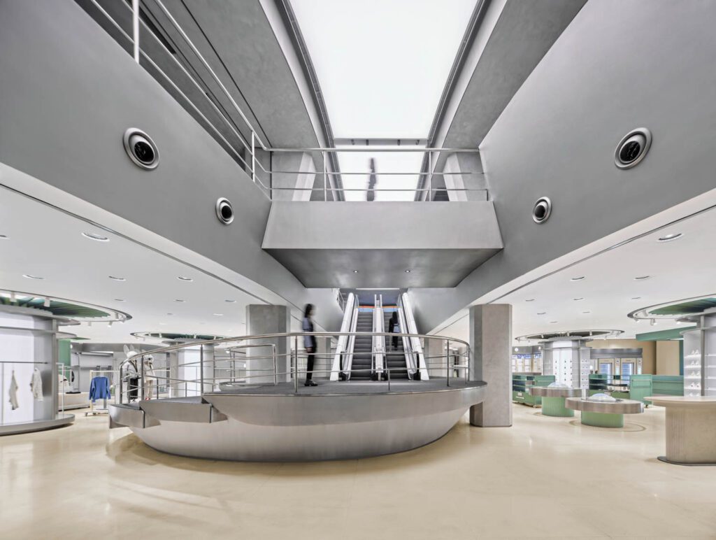 The narrative of the 21,500-square-foot interior centers on the brand being an intelligent species landed in Shanghai, the spiraling escalator platform recalling a spaceship’s base.