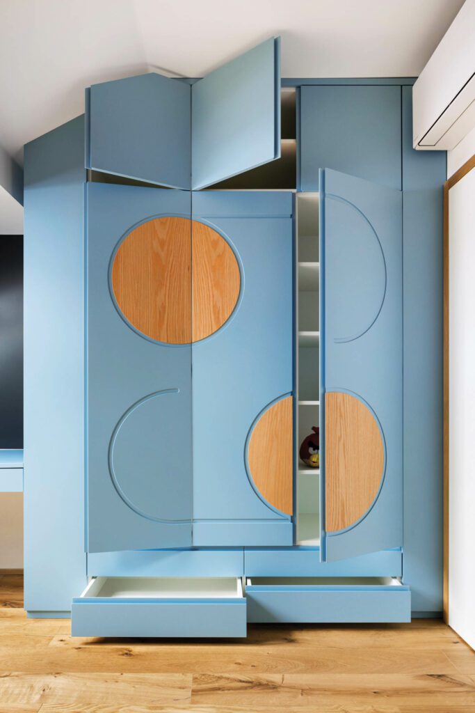 a blue set of drawers with circular accents