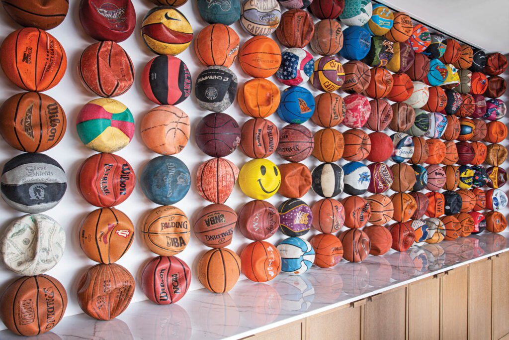 In founder and chairman Dan Gilbert’s office, Tyrrell Winston’s site-specific assemblage of 168 deflated basketballs includes some from the Cleveland Cavaliers, which Gilbert owns.