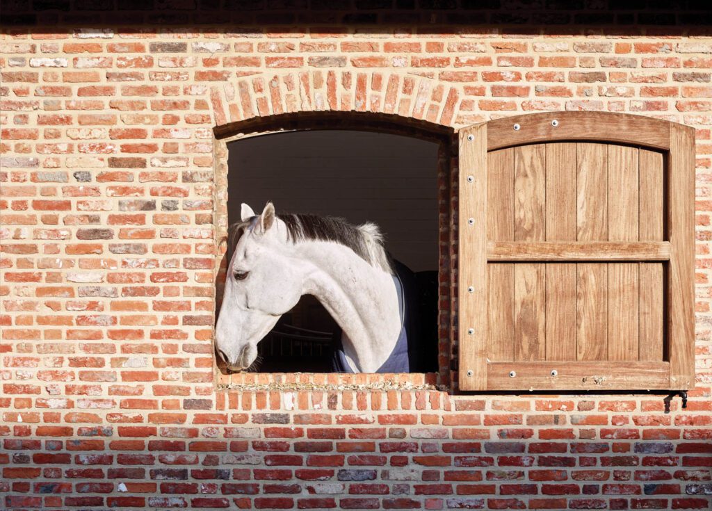 The stable’s shutters, also teak, were recently added.