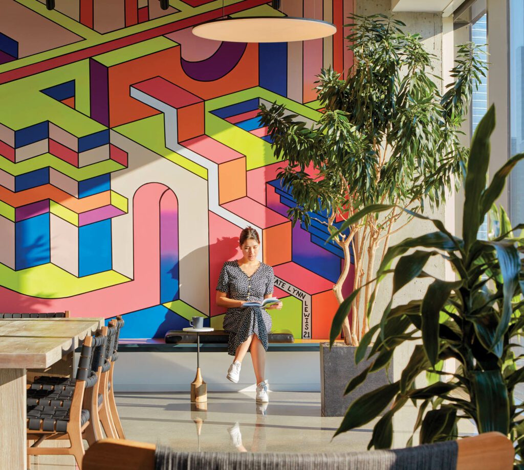 One of many custom artworks throughout 800 Fulton Market, a multi-tenant office building in Chicago by Skidmore, Owings & Merrill, is a Kate Lynn Lewis mural, which creates a focal point in the employee-only amenities area.