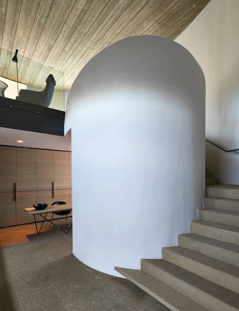 a cylindrical shape next to the stairs