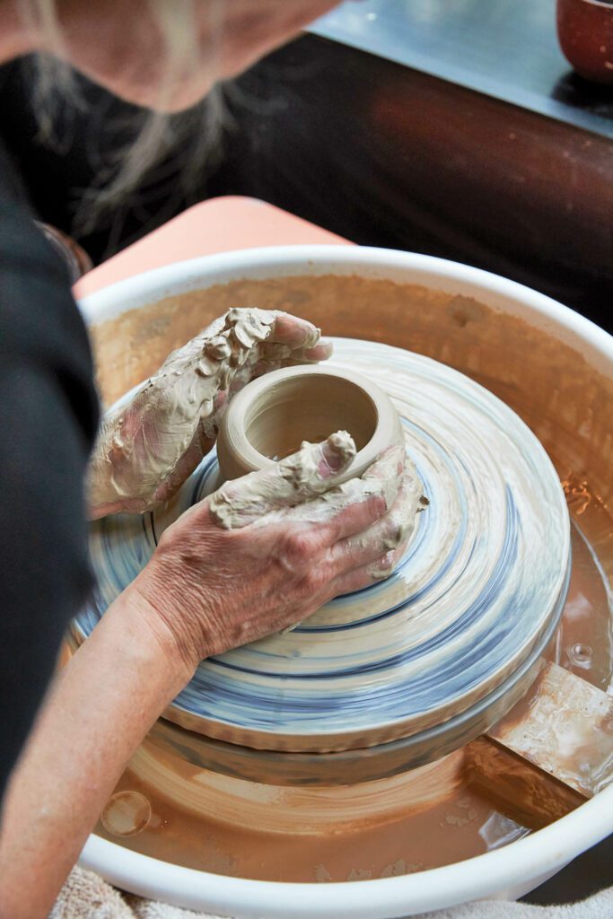 Gabriels creating a clay vessel on the potter’s wheel. Photography by Jan Verlinde/Living Inside.