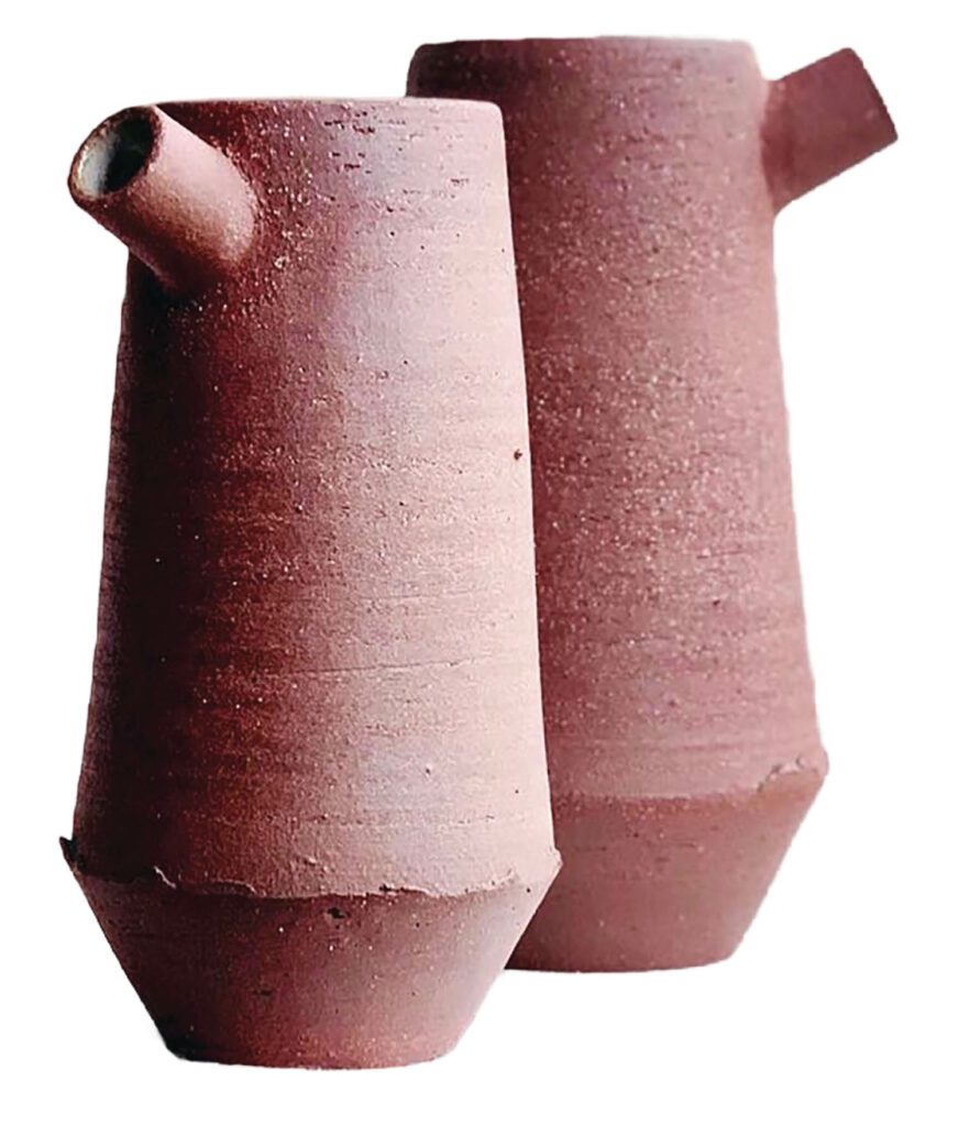 Jugs formed of red rough clay.