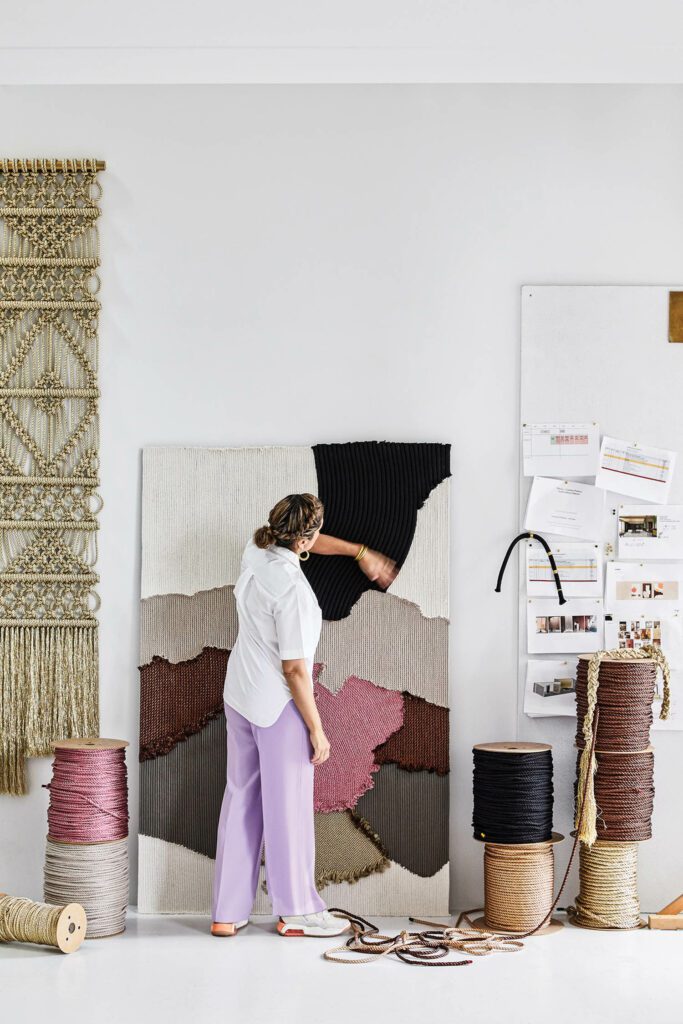 Novo weaving a ropework in her studio.