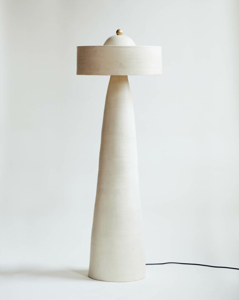 Helena floor lamp, with its five feet tall height, is the most visually accentuated piece in the eight-piece collection.