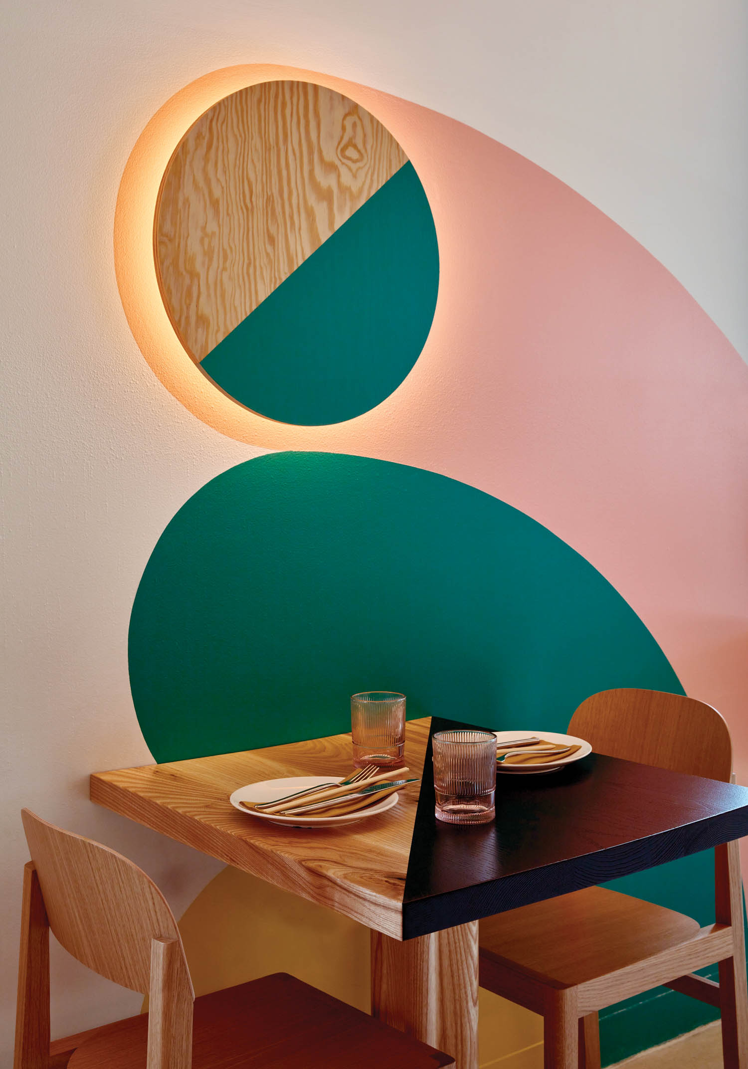 graphic designs above a dining table at Kpod