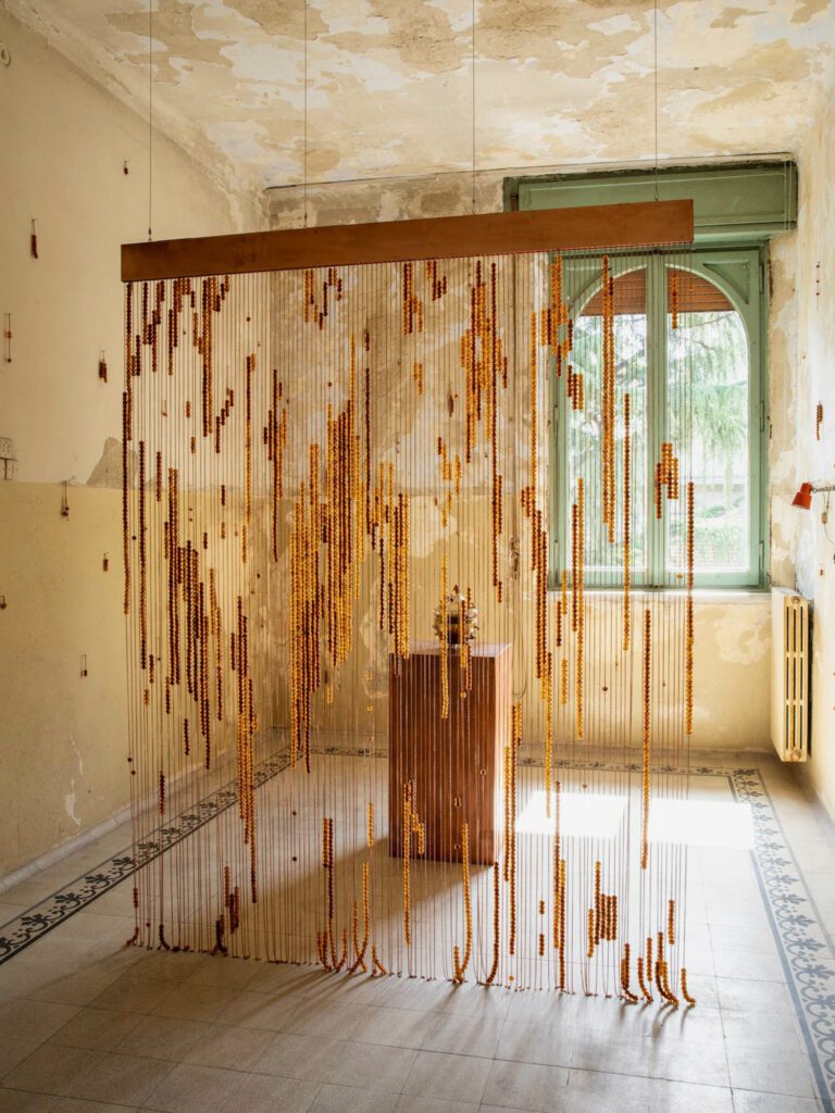 A play on light, sound, and shadow, Come, Stay Taste, a room divider by Studio Terre, is a customizable curtain of Murano glass and terracotta pearls that chime with the breeze. 