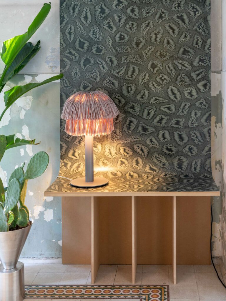 Raffia, a natural fiber composed of palm leaf cellulose, is the material used for the signature shade (with its bob-like haircut) of the Fran lamp by Llot Llov. The series also includes a pendant.