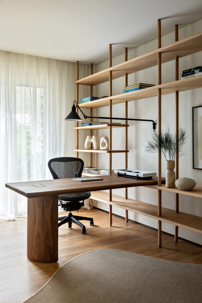 The wood desk and shelves in the home office were custom designed by Architects Office for the space.