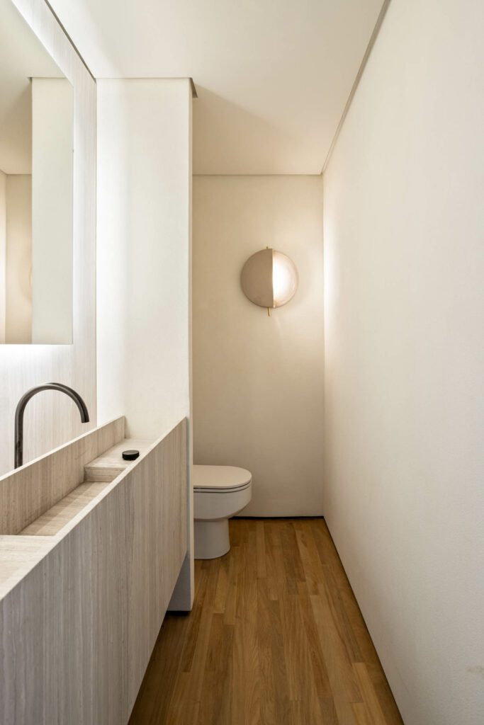 In a bathroom, the existing wood floor was restored.