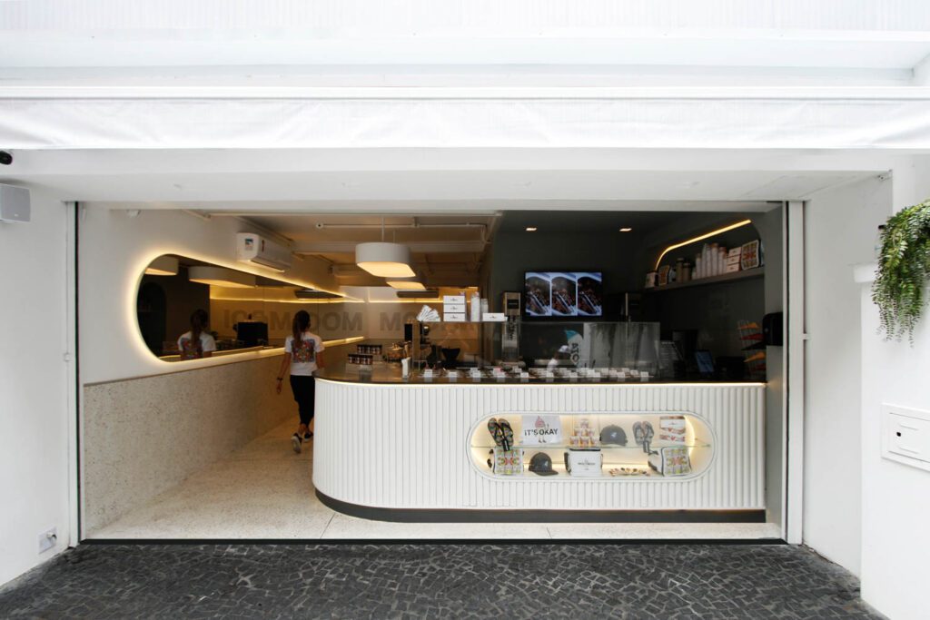 A custom mirror reflects the shape of the shop’s unique ice cream machine.