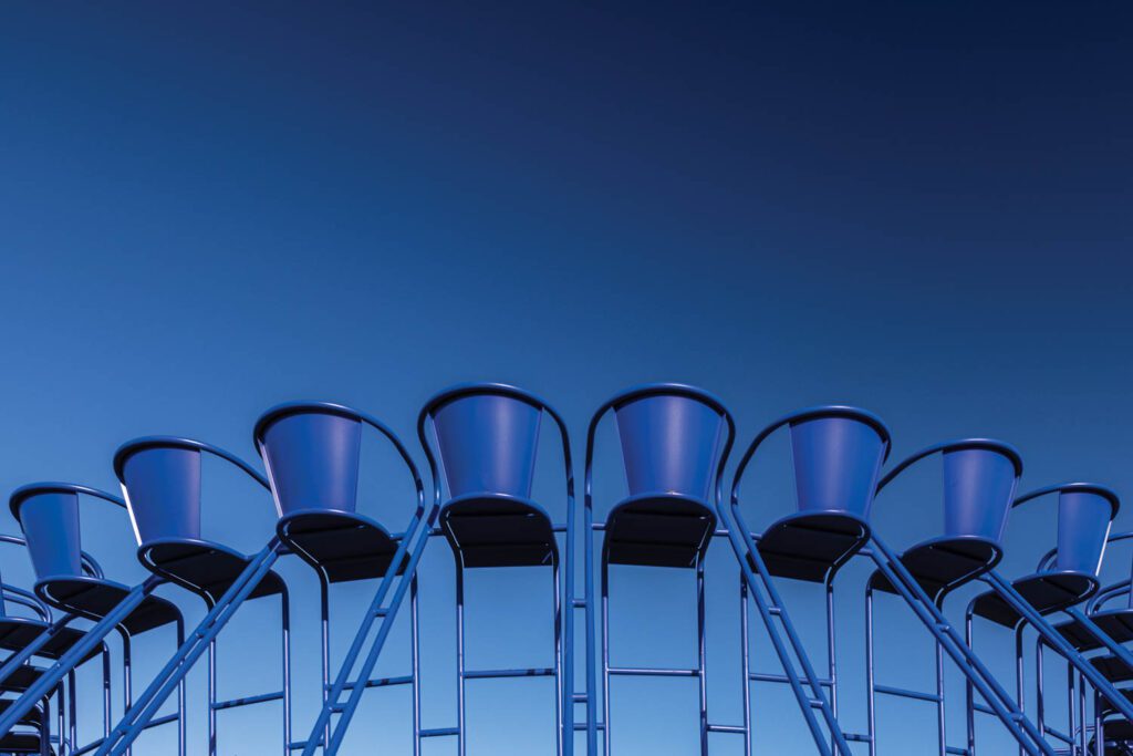 a closeup of blue steel stacking seats in a circle