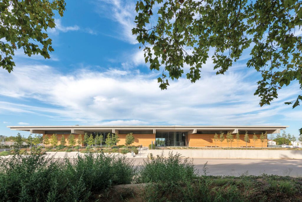 The single-story building comprises structural walls of packed dry-mix concrete sup­porting a cast-concrete roof.