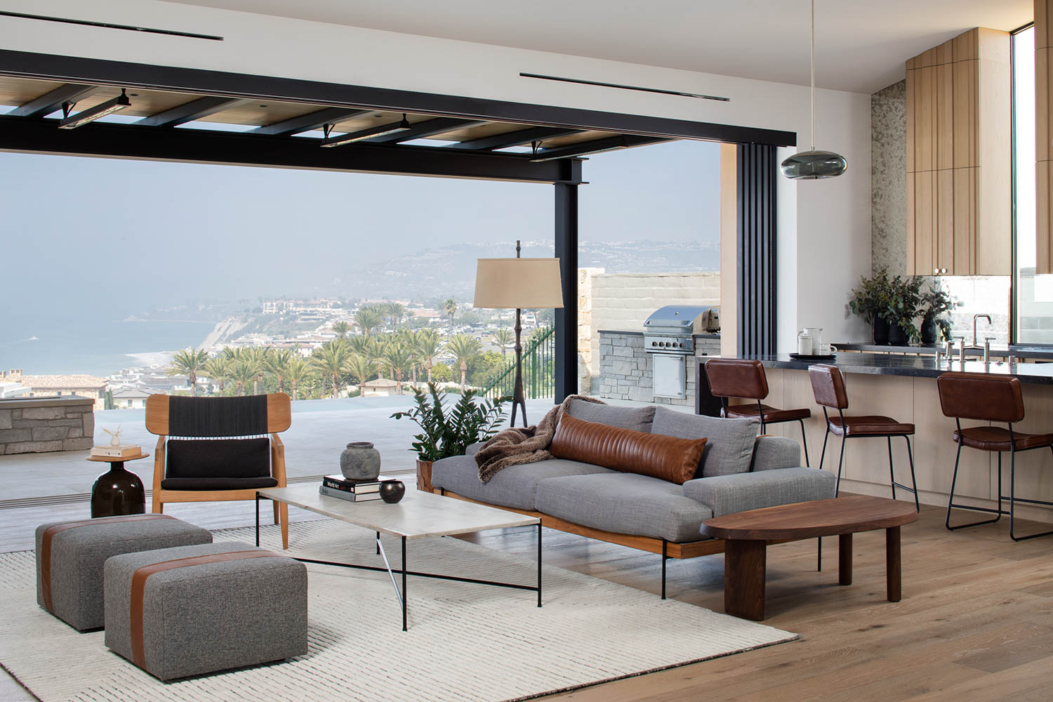 A living room that opens to a large patio in California