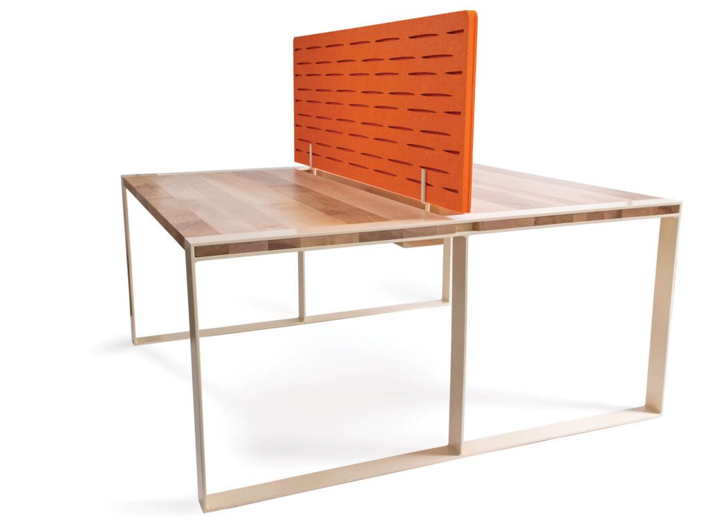 Matt Cheadle’s Lowe Loop desk benching system in solid wood  and steel with divider by Mantra Inspired Furniture. 