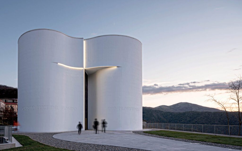 Santa Maria Goretti church in Mormanno, Calabria, entered through a cross-shape incision that is lit at night. Photography by Duccio Malagamba.