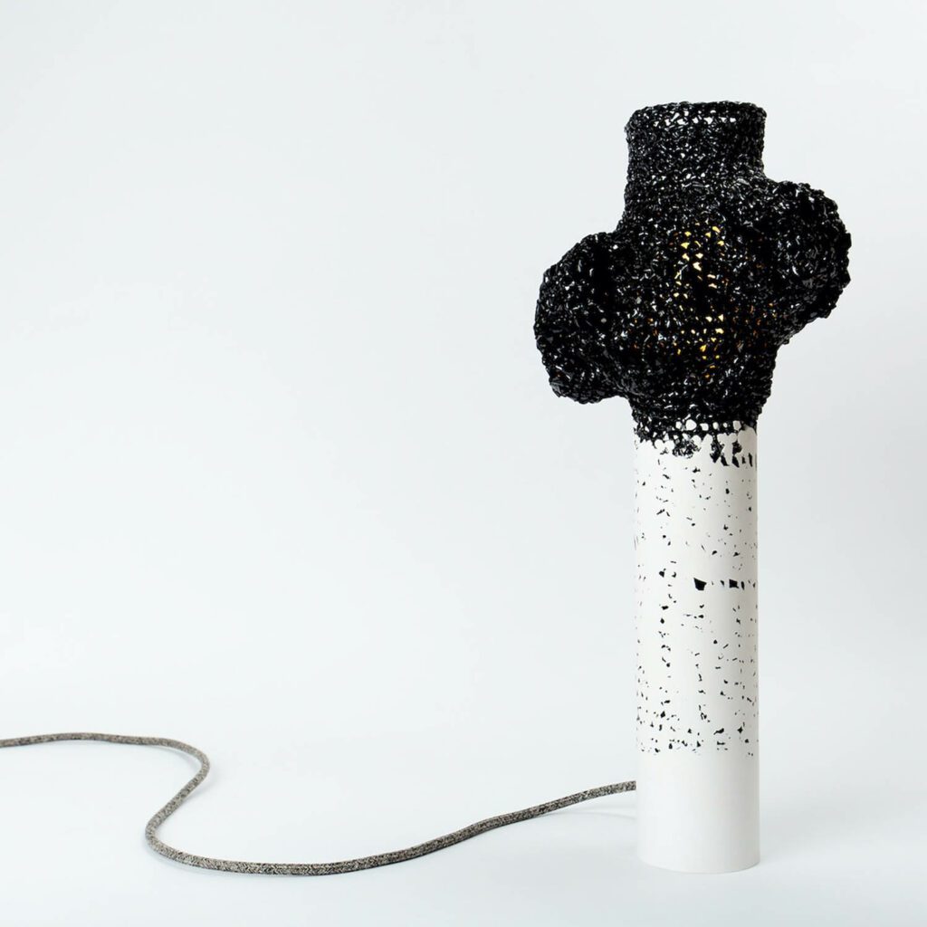 Magnetic tape, crochet fabric, and plaster is behind the unique finish of Lamp, the second prize winner by Studio Gilles Werbrouck in collaboration with Hugues Loinard Studio featured in “Belgium is Design.” 