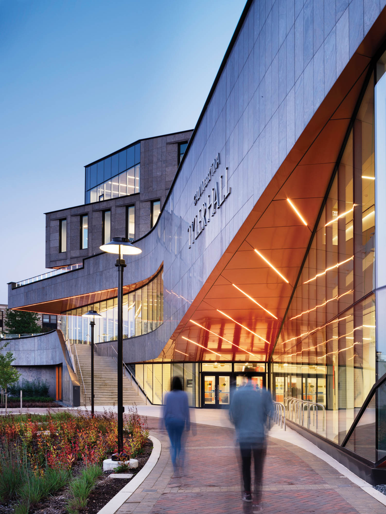 visitors walk past Calvin & Tina Tyler Hall, Morgan State University, Baltimore by Teeple Architects