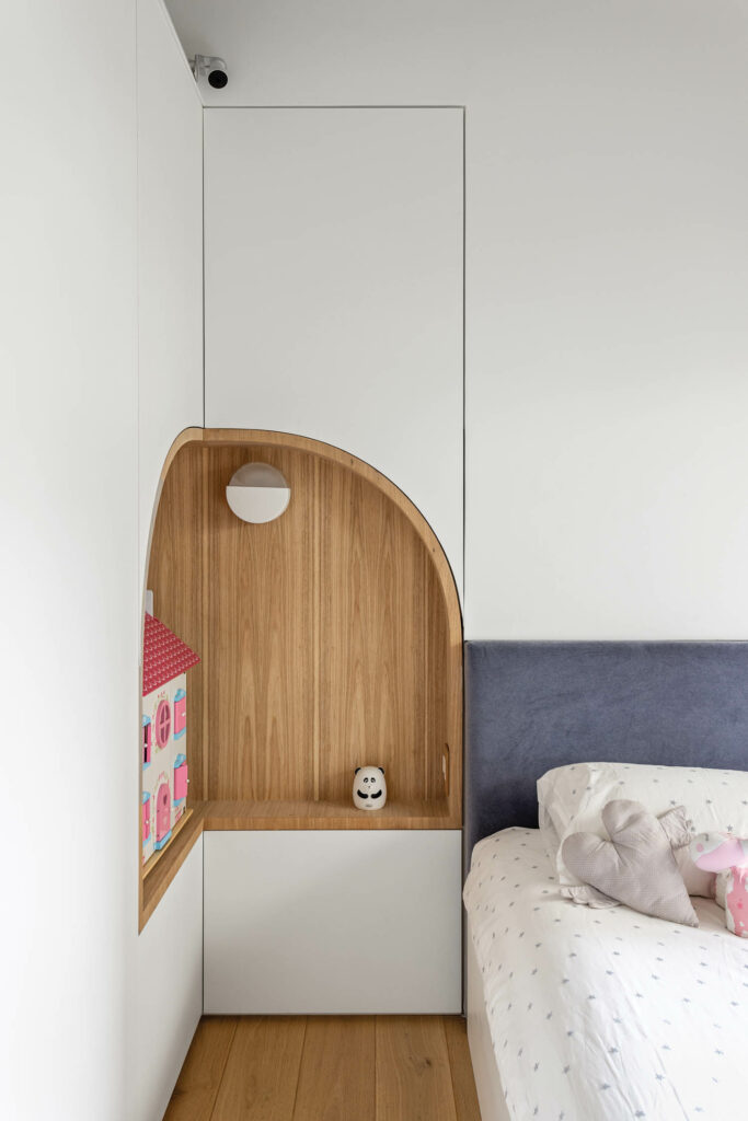 Pascali Semerdjian’s Duna sconce, which contains sand and can be rotated like an hourglass, lights a niche in a child’s bedroom.