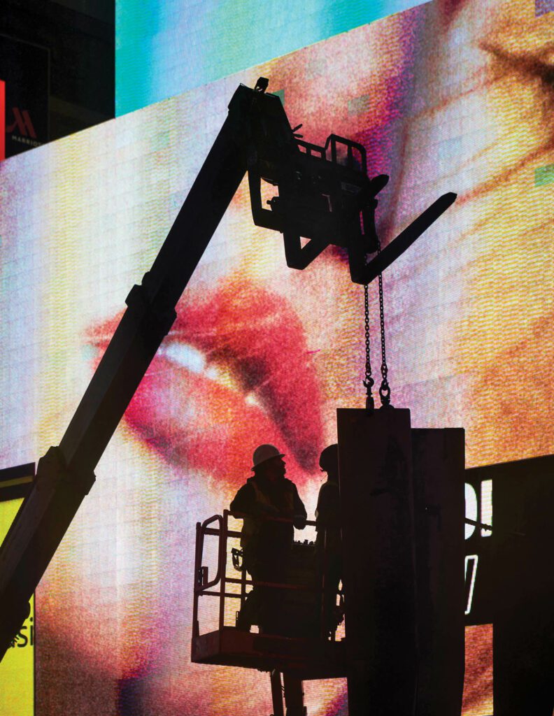 The Times Square billboards provided lighting during building, which began at 11 p.m. due to municipal regulations. 