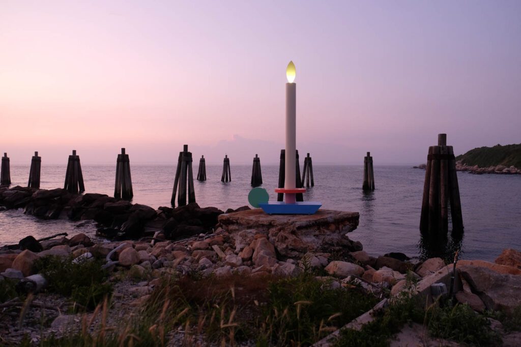 At dusk the “flame” is lit by an internal LED.