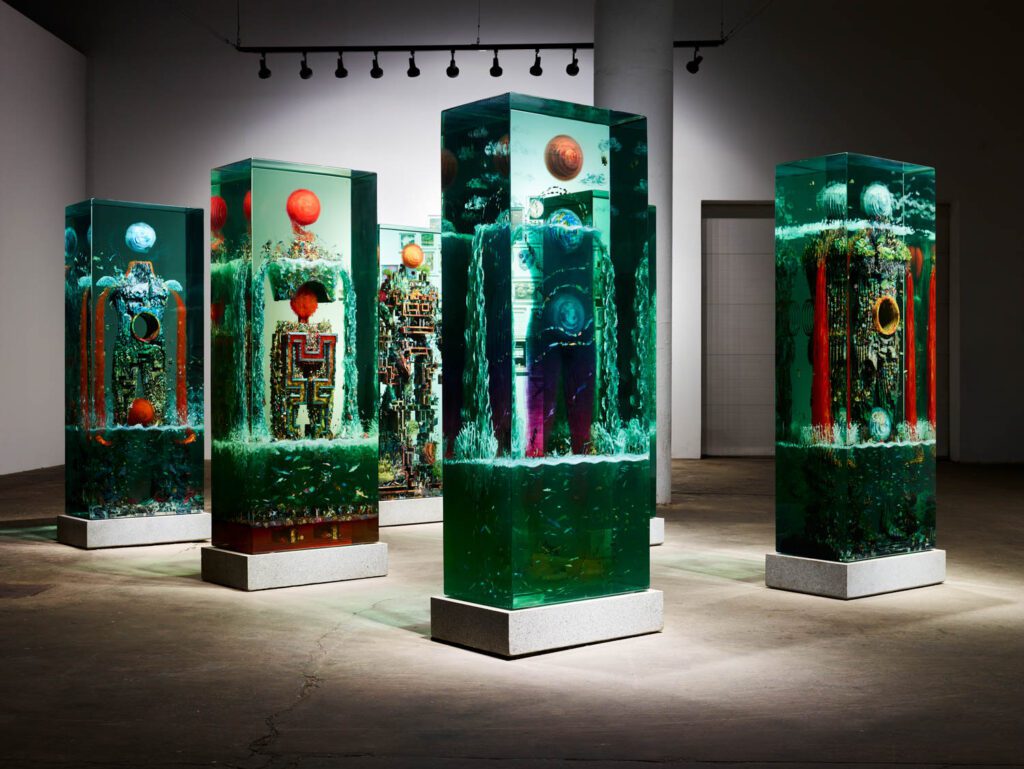 artwork lit up inside Dustin Yellin's studio