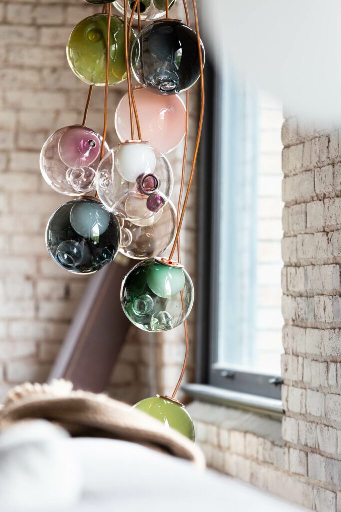 A translucent lighting detail illuminates a seating area in the living room. 