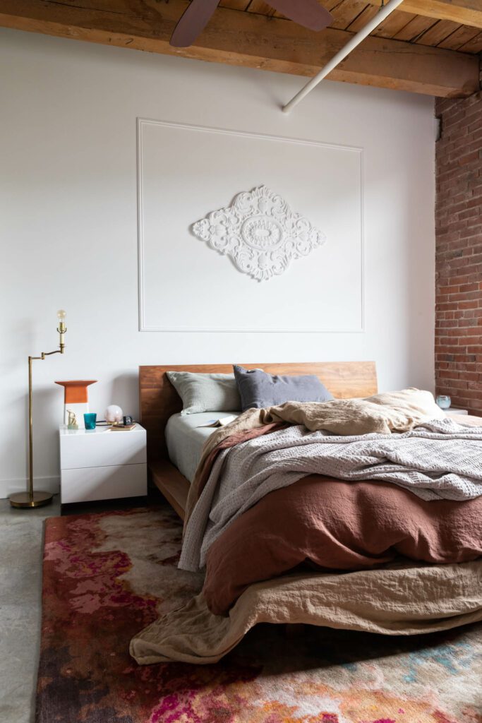 The main bedroom features an ornate wall detail. 