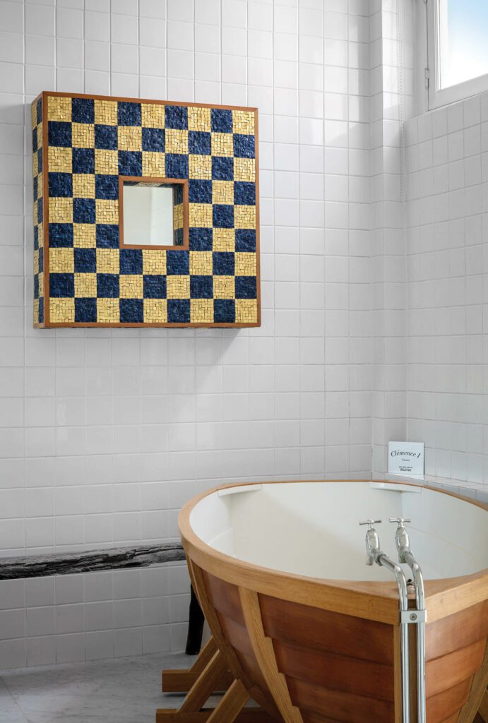 An Alessandro Mendini mirror is paired with Dutch designer Wieki Somers’s playful Bath Boat in the principal bathroom