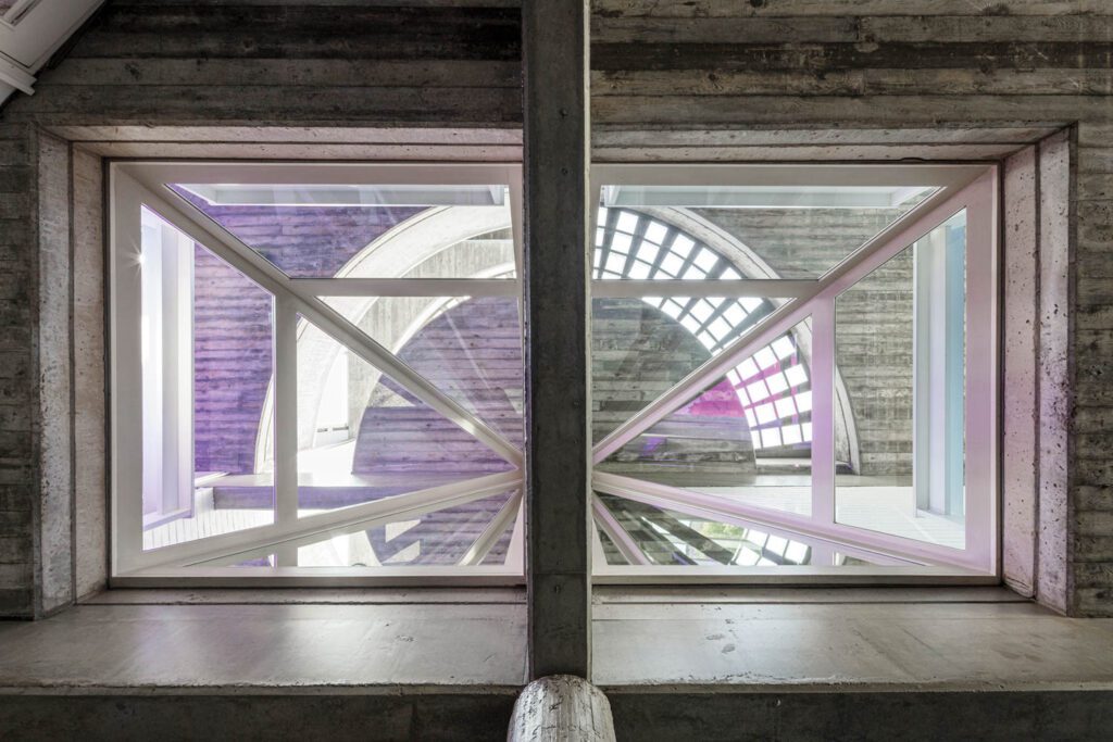 Looking up through the skylight reveals that the house is a stack of three geometric forms: a square, a triangle, and a cylinder.