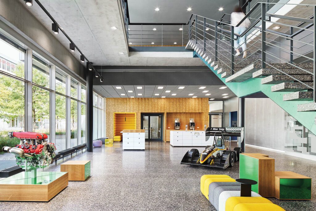 an entry room with green accented stairs