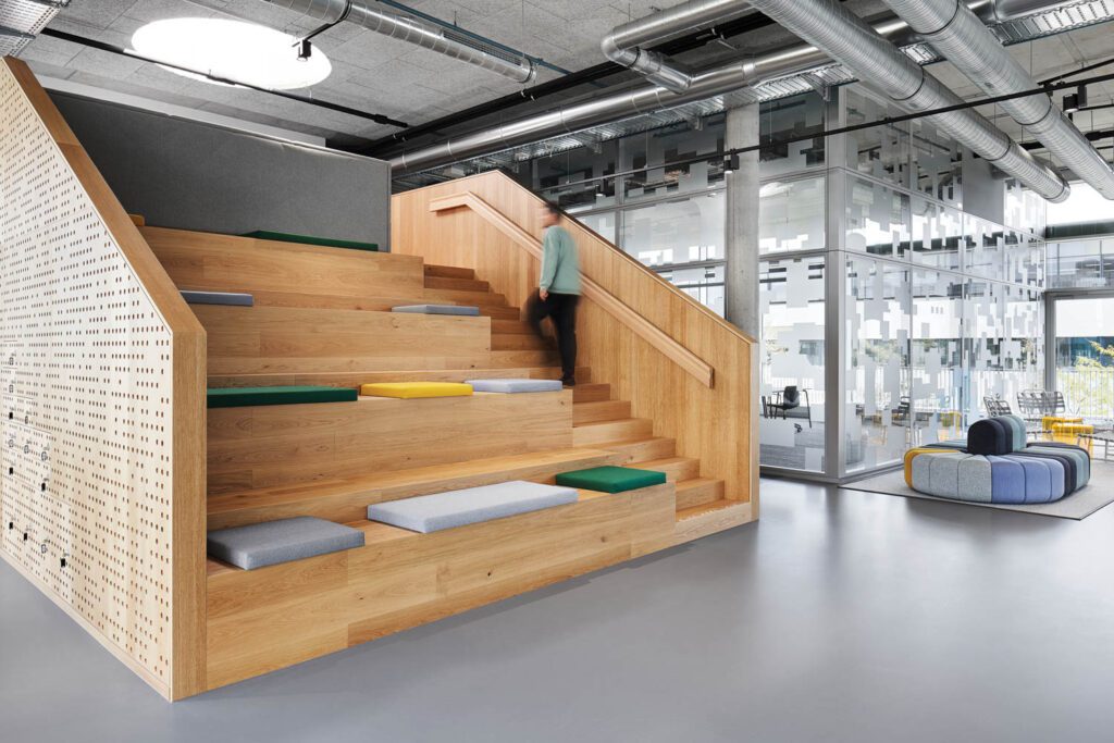 a wooden stairway flanked by bleacher seating