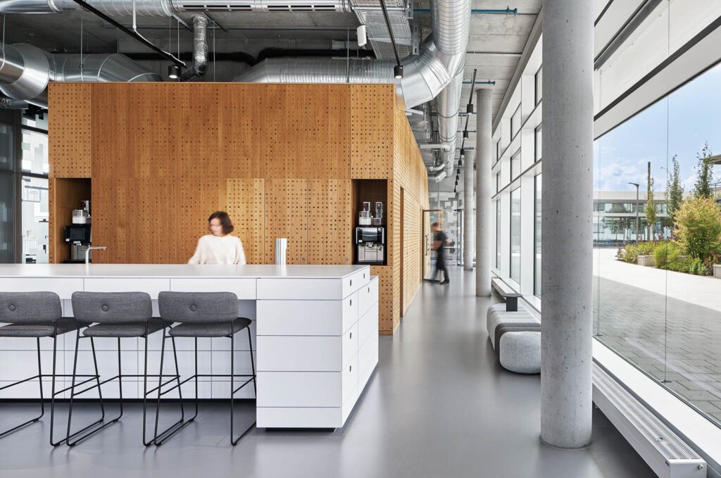 a kitchenette with bar stools