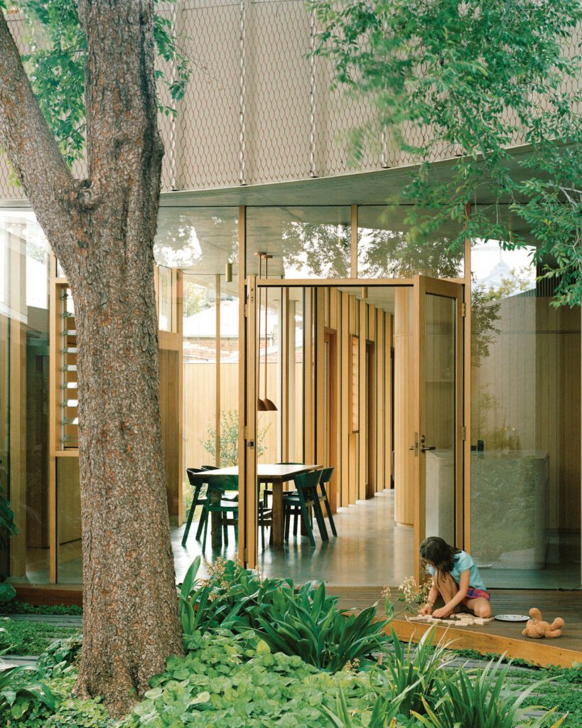 A mature elm grows in the courtyard; doors and windows are framed in Victorian ash, a kind of eucalyptus.