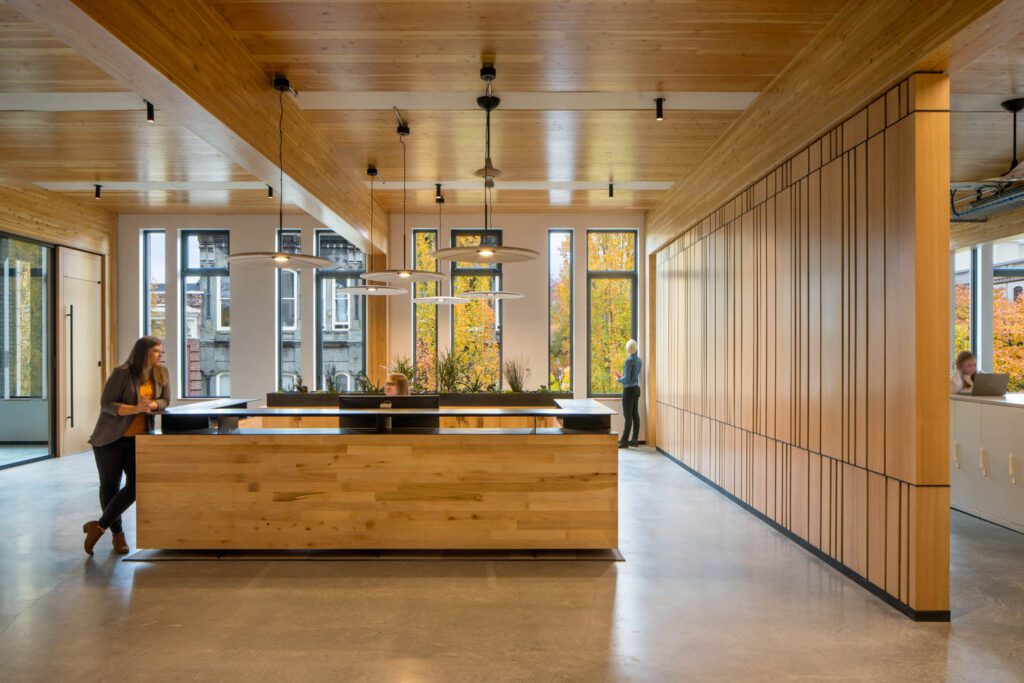 the third-floor reception desk made of repurposed wood