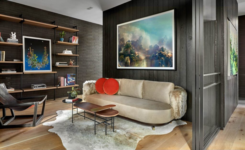 a lounge area with a champagne colored sofa