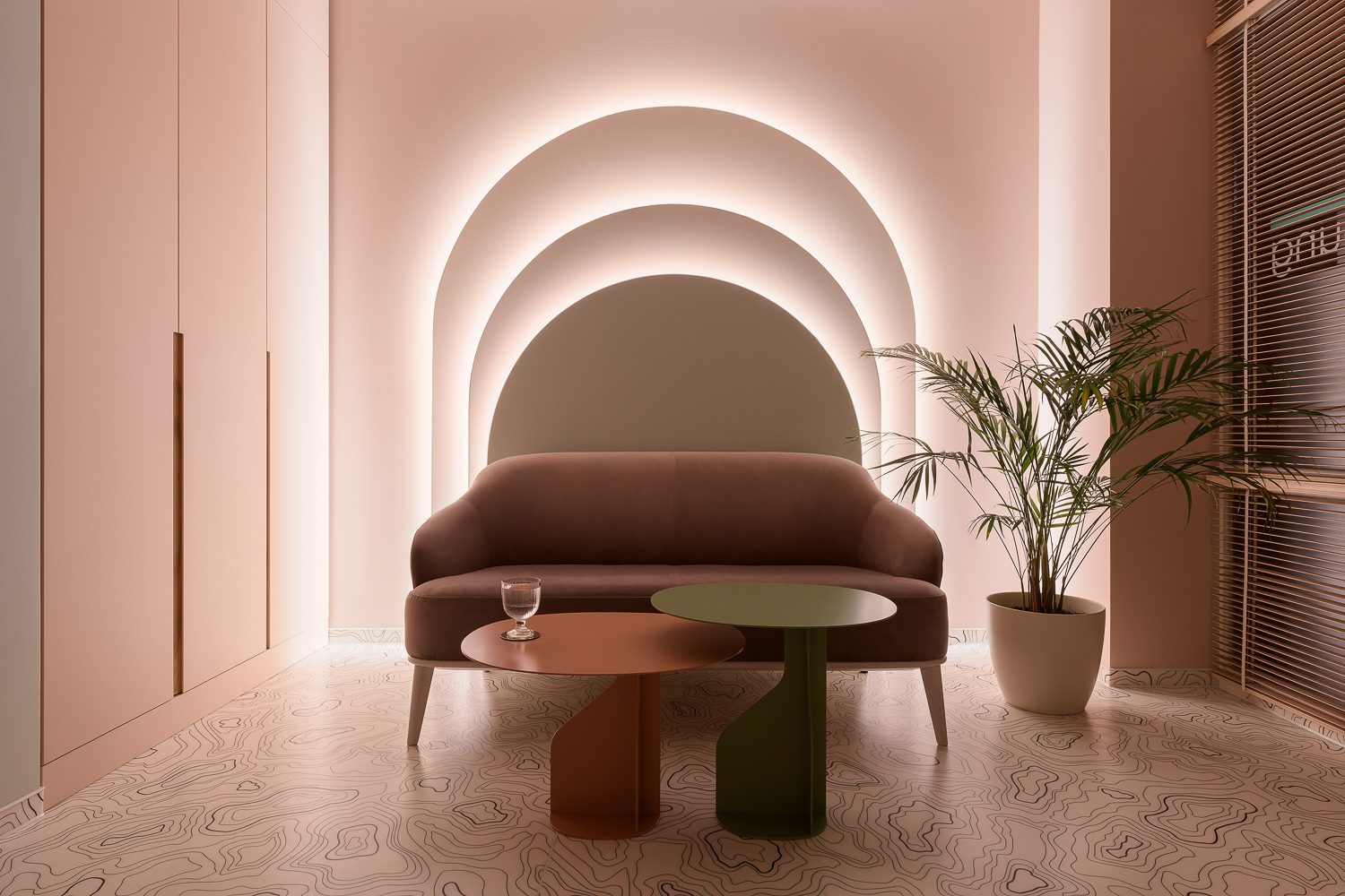 light pink painted walls are in the sitting area of a wellness center