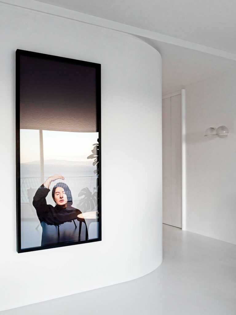 Marina Abramovicˉ’s Ecstasy II hangs in the living area; flooring is resin.