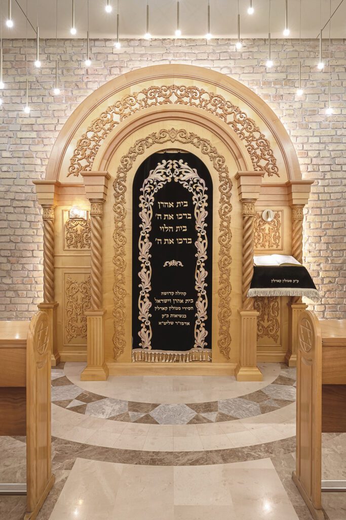 Restored brick painted white frames the chamber that houses the Torah scrolls.