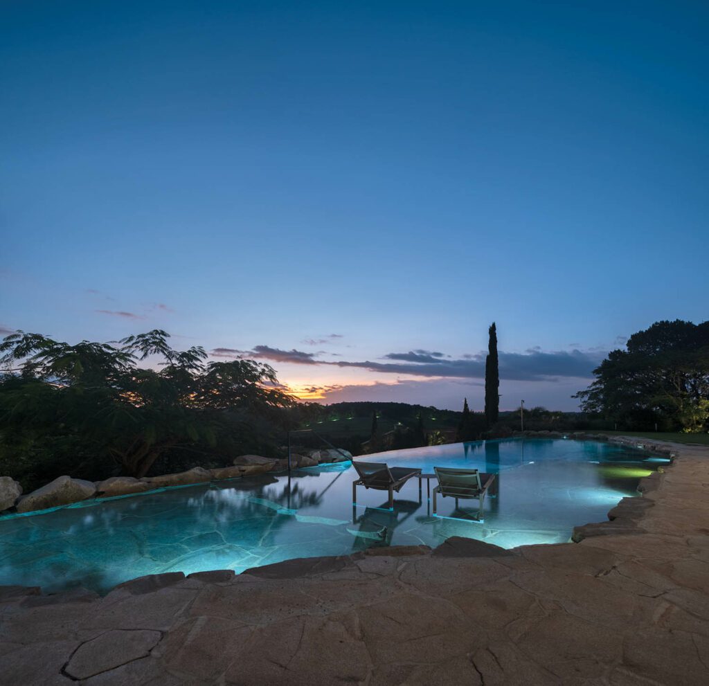 The dramatically lighted infinity pool is an ideal spot for taking in the sunset. 