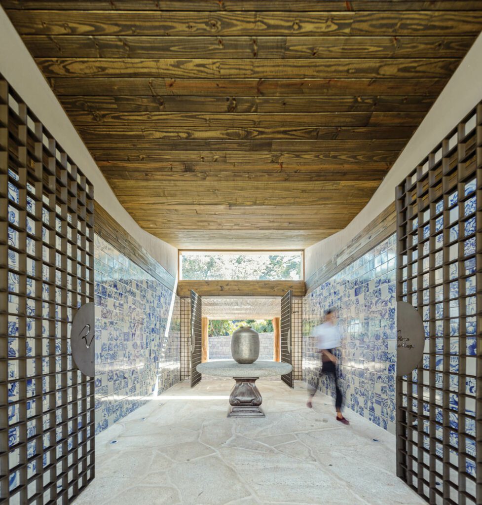 The walls of the guesthouse entry are clad in Portuguese azulejo tiles, a nod to the heritage of both the owner and his purebred horses.