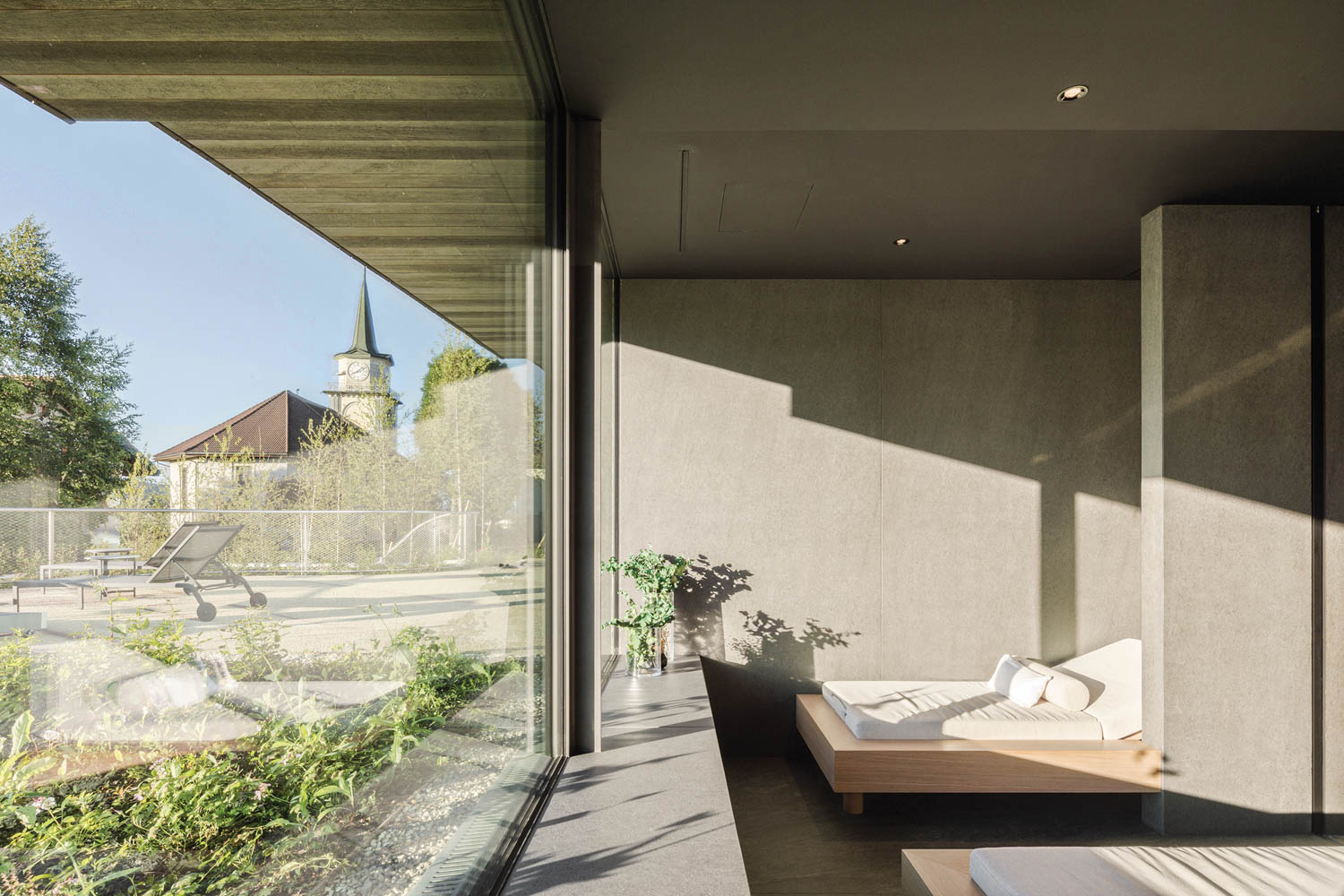 a bedroom looking out of a large glass window