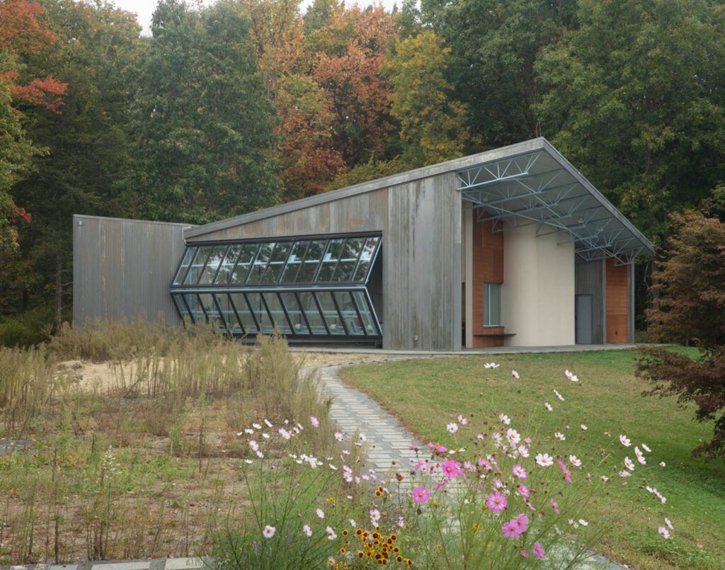 the mechanized hangar door opening on the pool house